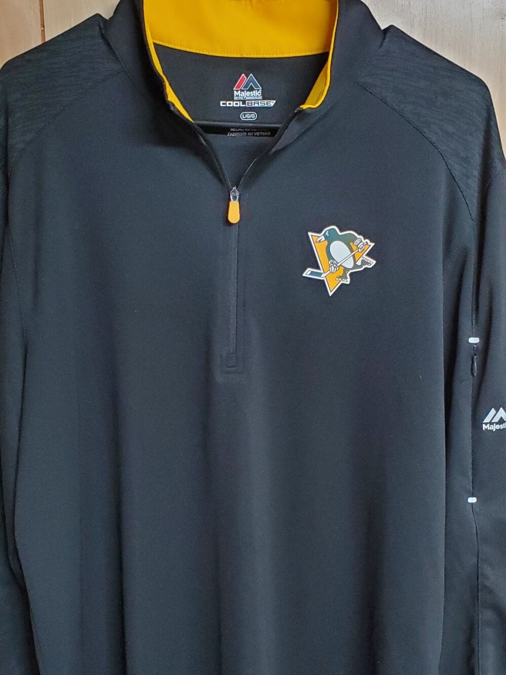 Majestic Athletic Cool Base Pittsburgh Penguins 1/4-Zip Pullover Jacket.